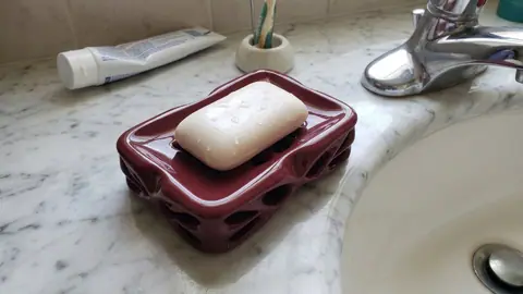 Shelf-ready bathroom accessory
